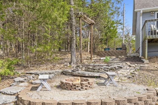 view of yard with an outdoor fire pit