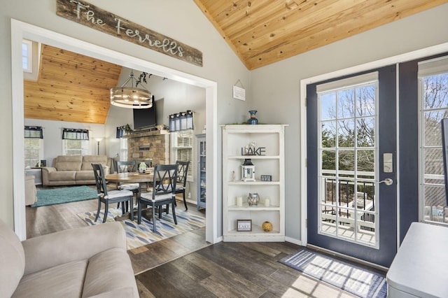entryway with dark wood-style floors, baseboards, vaulted ceiling, and wooden ceiling