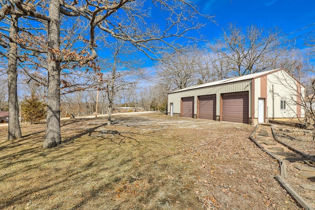 25827 Canyon Dr, Hermitage, MO 65668 - view of yard featuring an outdoor structure and a garage