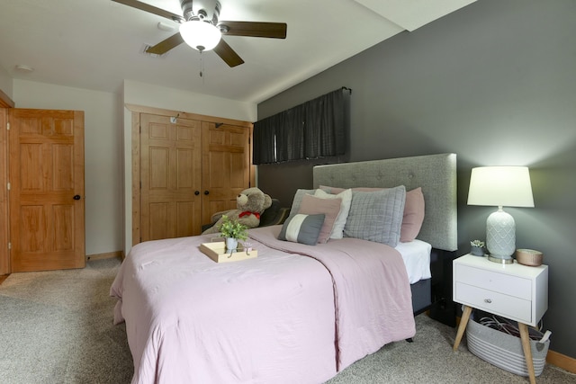 1428 Acacia Club Rd, Hollister, MO 65672 - carpeted bedroom featuring a closet, baseboards, and ceiling fan