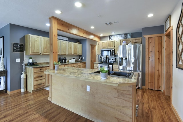 1428 Acacia Club Rd, Hollister, MO 65672 - kitchen with dark wood-type flooring, visible vents, light brown cabinetry, and stainless steel appliances