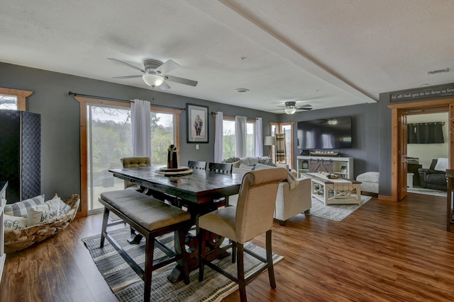 1428 Acacia Club Rd, Hollister, MO 65672 - dining space featuring visible vents, baseboards, a ceiling fan, and wood finished floors
