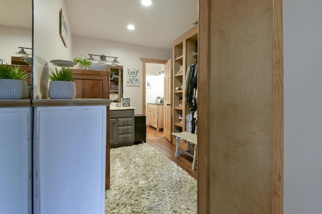 1428 Acacia Club Rd, Hollister, MO 65672 - laundry area featuring recessed lighting and wood finished floors