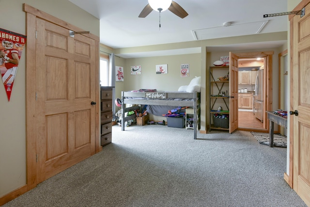 1428 Acacia Club Rd, Hollister, MO 65672 - carpeted bedroom featuring ensuite bathroom, freestanding refrigerator, and a ceiling fan