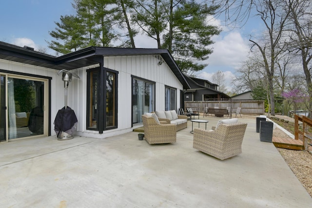 1428 Acacia Club Rd, Hollister, MO 65672 - view of patio / terrace with an outdoor living space, a wooden deck, and fence