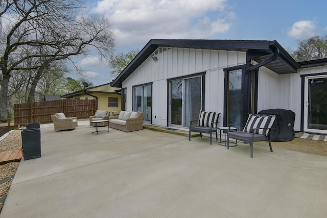1428 Acacia Club Rd, Hollister, MO 65672 - back of property with fence and a patio