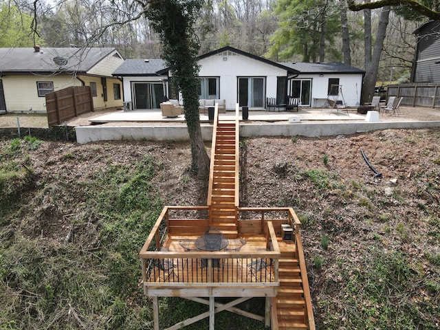 1428 Acacia Club Rd, Hollister, MO 65672 - back of house featuring a patio area, fence, and stairs