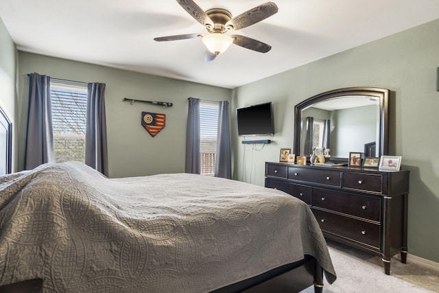 32 Homewood Ln, Kimberling City, MO 65686 - bedroom featuring a ceiling fan, baseboards, light colored carpet, and multiple windows