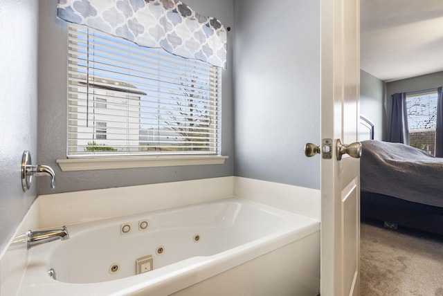 32 Homewood Ln, Kimberling City, MO 65686 - ensuite bathroom featuring ensuite bathroom and a tub with jets