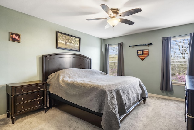 32 Homewood Ln, Kimberling City, MO 65686 - bedroom featuring baseboards, ceiling fan, and light colored carpet