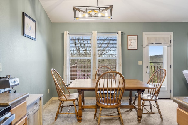 32 Homewood Ln, Kimberling City, MO 65686 - dining area with baseboards, a chandelier, and light carpet