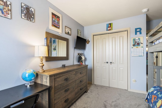 32 Homewood Ln, Kimberling City, MO 65686 - bedroom featuring baseboards, light carpet, and a closet
