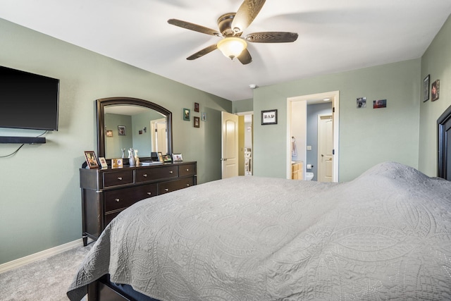 32 Homewood Ln, Kimberling City, MO 65686 - carpeted bedroom with connected bathroom, baseboards, and ceiling fan