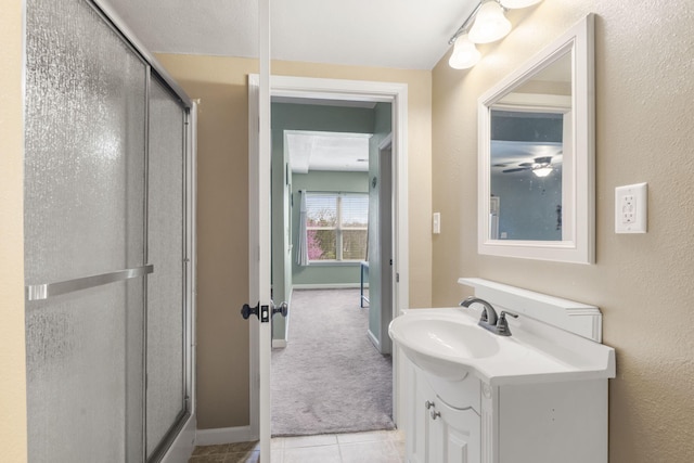 32 Homewood Ln, Kimberling City, MO 65686 - bathroom featuring baseboards, a shower stall, tile patterned flooring, and vanity