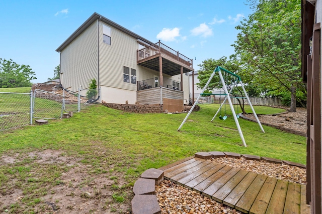 32 Homewood Ln, Kimberling City, MO 65686 - rear view of house featuring a deck, a fenced backyard, a balcony, a playground, and a yard