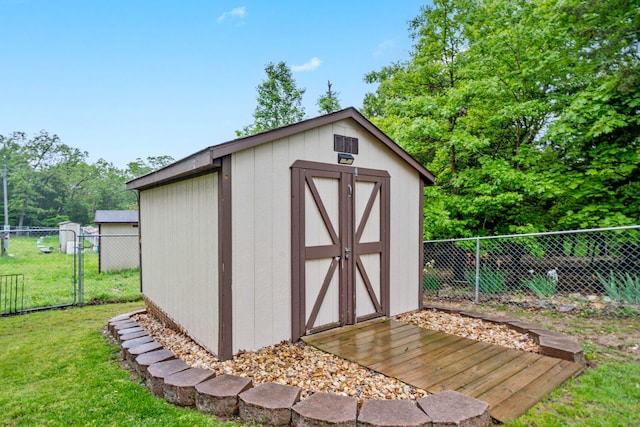 32 Homewood Ln, Kimberling City, MO 65686 - view of shed with a fenced backyard and a gate