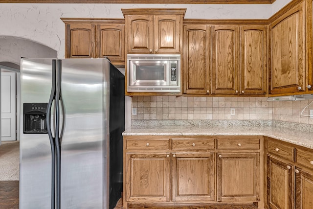 3607 Quail Run Rd, West Plains, MO 65775 - kitchen with stainless steel appliances, tasteful backsplash, and brown cabinets