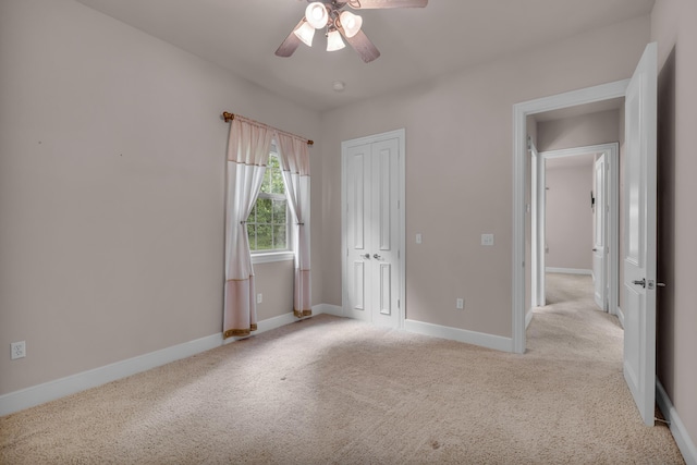 3607 Quail Run Rd, West Plains, MO 65775 - unfurnished bedroom featuring light colored carpet, a closet, baseboards, and ceiling fan