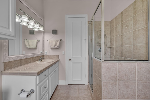 3607 Quail Run Rd, West Plains, MO 65775 - bathroom featuring a stall shower, vanity, and tile patterned floors