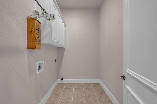 3607 Quail Run Rd, West Plains, MO 65775 - laundry area with cabinet space, light tile patterned floors, baseboards, hookup for an electric dryer, and washer hookup