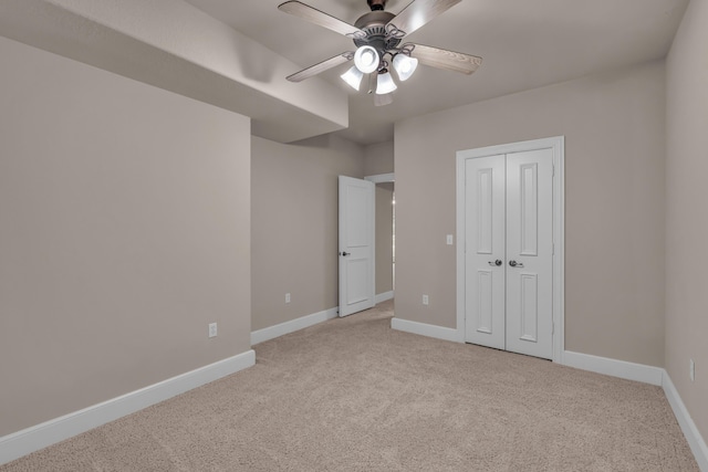 3607 Quail Run Rd, West Plains, MO 65775 - unfurnished bedroom with light colored carpet, baseboards, a closet, and ceiling fan
