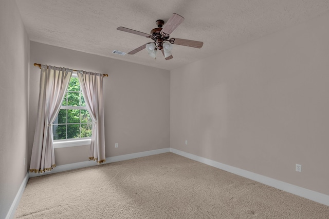 3607 Quail Run Rd, West Plains, MO 65775 - carpeted spare room featuring a textured ceiling, a ceiling fan, and baseboards