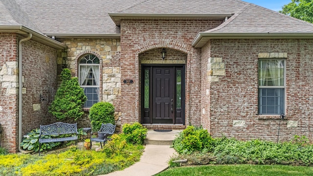 3607 Quail Run Rd, West Plains, MO 65775 - view of exterior entry with a shingled roof and brick siding