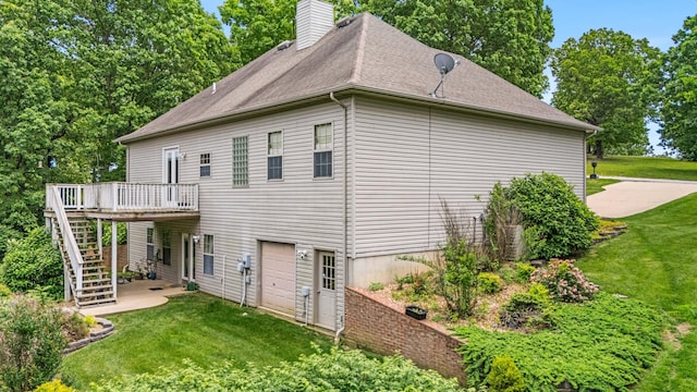 3607 Quail Run Rd, West Plains, MO 65775 - view of side of home featuring a lawn, a deck, an attached garage, stairway, and a chimney