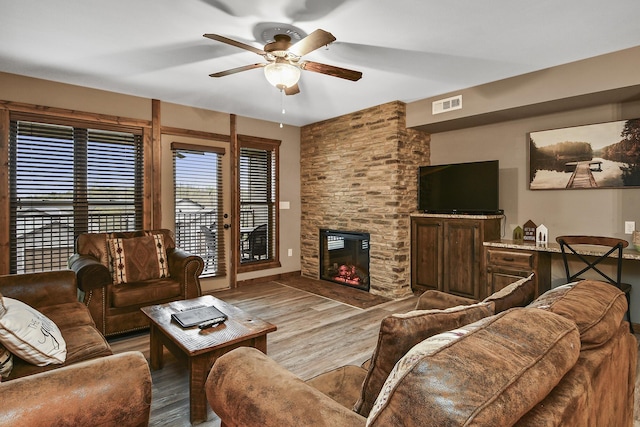164 Dogwood Park Trl Bldg 1204, Branson, MO 65616 - living area featuring a brick fireplace, visible vents, wood finished floors, and a ceiling fan