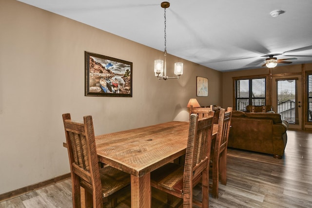 164 Dogwood Park Trl Bldg 1204, Branson, MO 65616 - dining room with ceiling fan with notable chandelier, baseboards, and wood finished floors