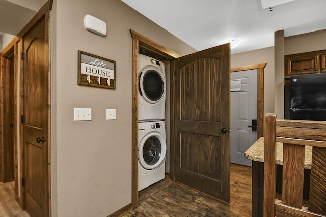 164 Dogwood Park Trl Bldg 1204, Branson, MO 65616 - clothes washing area with stacked washer and clothes dryer, laundry area, and dark wood finished floors