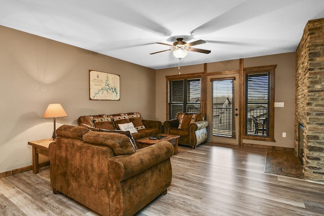 164 Dogwood Park Trl Bldg 1204, Branson, MO 65616 - living room featuring baseboards, ceiling fan, wood finished floors, and a large fireplace