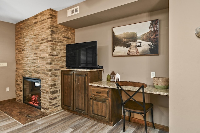 164 Dogwood Park Trl Bldg 1204, Branson, MO 65616 - interior space with a stone fireplace, baseboards, visible vents, and wood finished floors