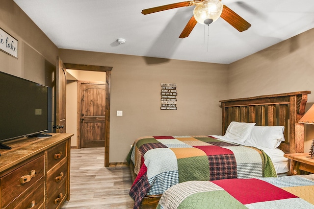 164 Dogwood Park Trl Bldg 1204, Branson, MO 65616 - bedroom with baseboards, light wood-style floors, and ceiling fan