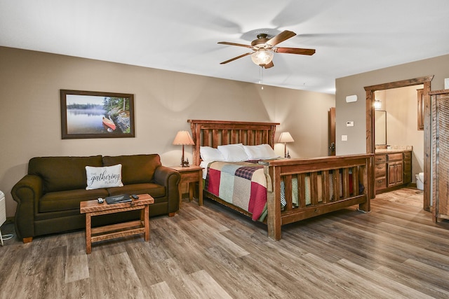 164 Dogwood Park Trl Bldg 1204, Branson, MO 65616 - bedroom featuring connected bathroom, wood finished floors, and a ceiling fan