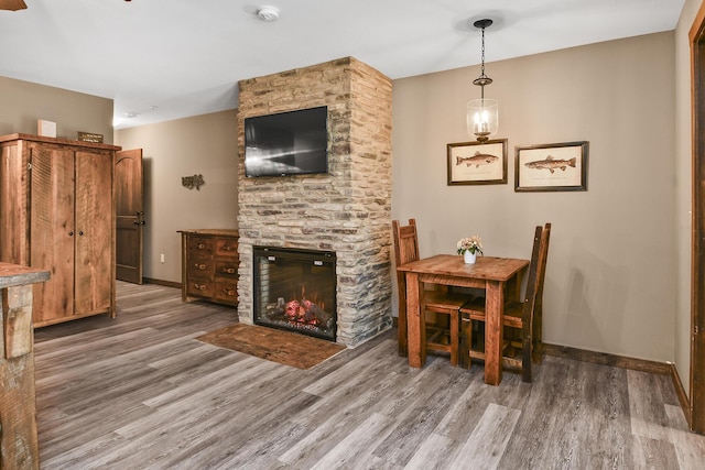 164 Dogwood Park Trl Bldg 1204, Branson, MO 65616 - dining room with a stone fireplace, baseboards, and wood finished floors