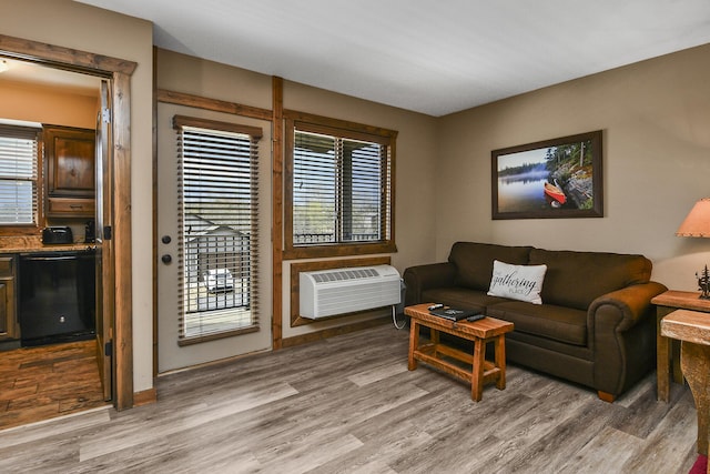 164 Dogwood Park Trl Bldg 1204, Branson, MO 65616 - living room featuring a wall mounted AC and light wood-style floors