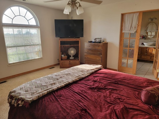 7 Lawrence Unit 2200, Wentworth, MO 64873 - bedroom with a sink, baseboards, light colored carpet, connected bathroom, and ceiling fan