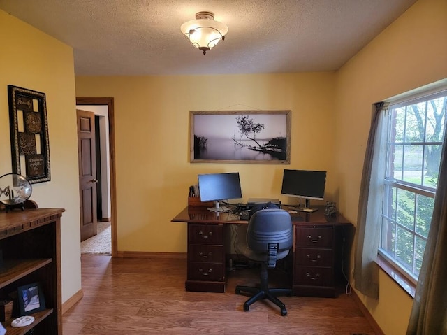 7 Lawrence Unit 2200, Wentworth, MO 64873 - office area featuring wood finished floors, baseboards, and a textured ceiling