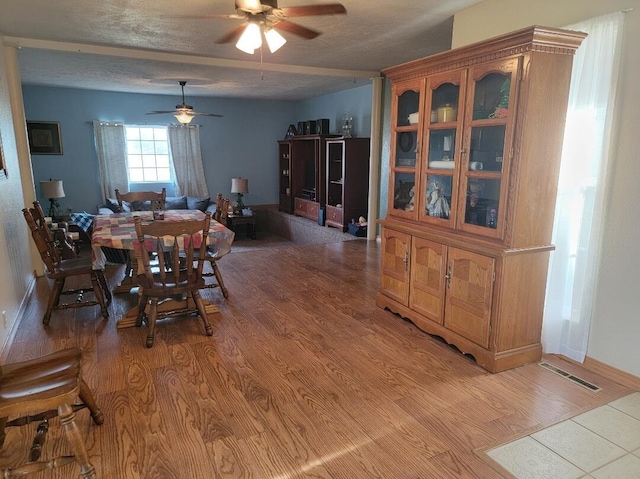 7 Lawrence Unit 2200, Wentworth, MO 64873 - dining space with ceiling fan, light wood-style flooring, and baseboards
