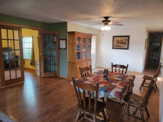 7 Lawrence Unit 2200, Wentworth, MO 64873 - dining room with french doors, baseboards, wood finished floors, a textured ceiling, and ceiling fan