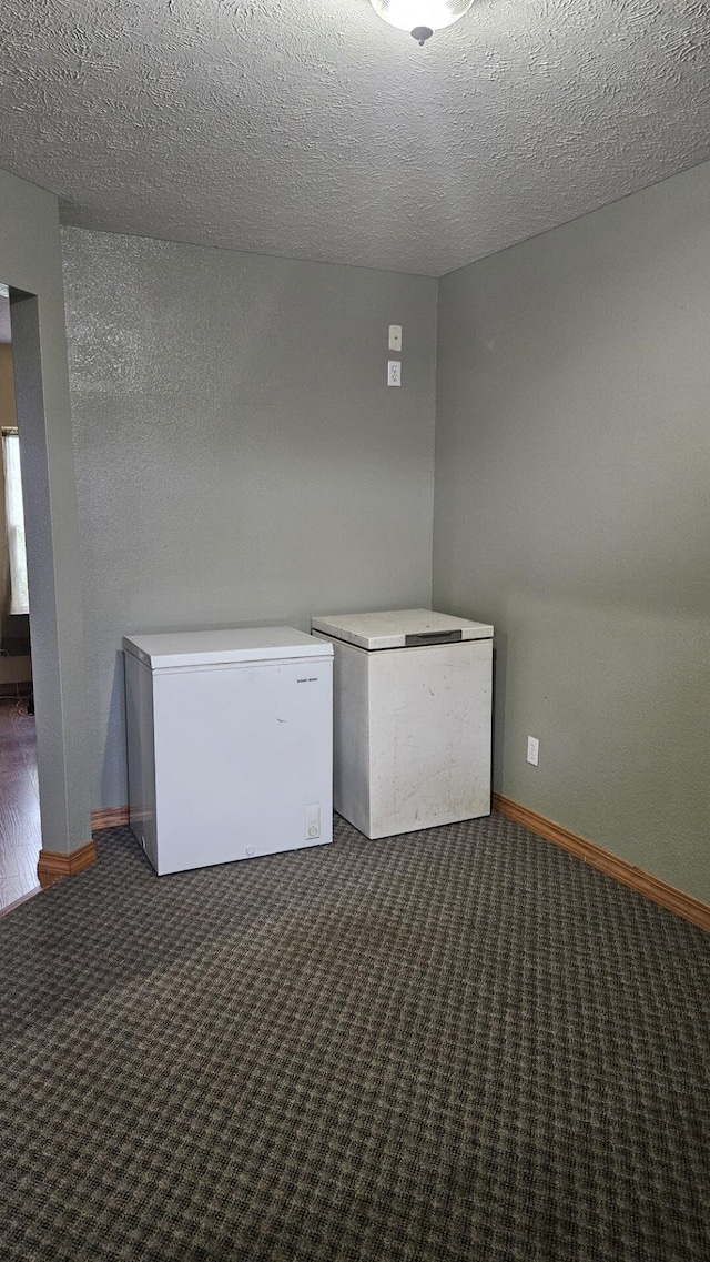 7 Lawrence Unit 2200, Wentworth, MO 64873 - carpeted empty room with baseboards and a textured ceiling