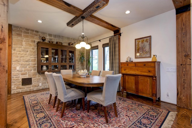 dining space featuring wood finished floors, recessed lighting, and beam ceiling