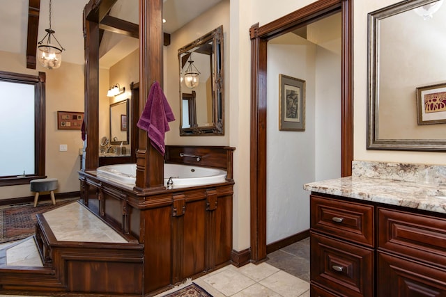 full bathroom featuring baseboards, tile patterned floors, and vanity