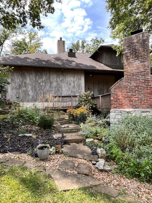 view of property exterior featuring a chimney