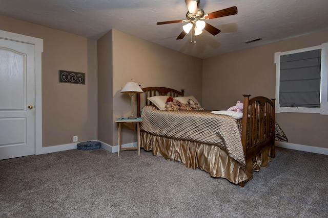 carpeted bedroom featuring baseboards, visible vents, and ceiling fan