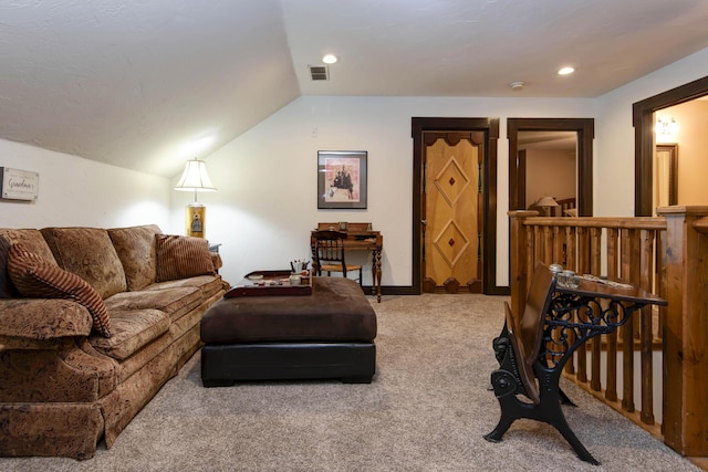 carpeted living area with visible vents, vaulted ceiling, and recessed lighting
