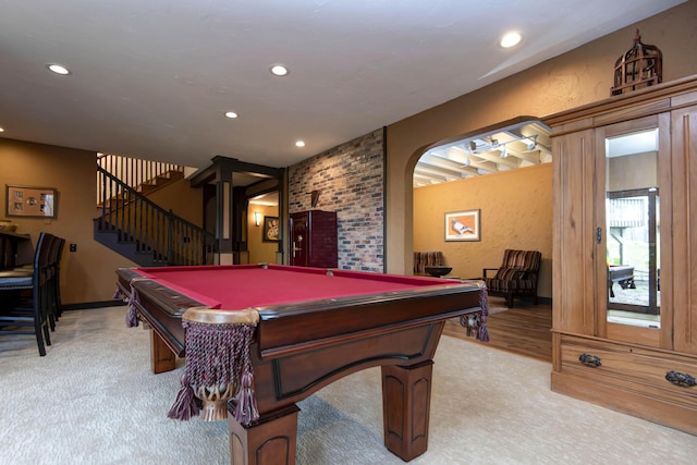 game room featuring recessed lighting, a textured wall, arched walkways, light carpet, and pool table