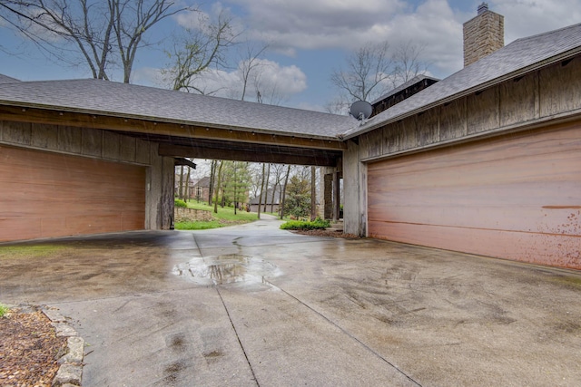 garage featuring driveway