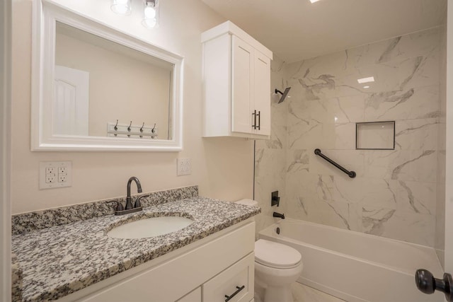 bathroom with toilet, vanity, and shower / washtub combination